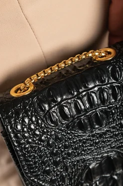 Borsa a mano piccola con fantasia pelle di coccodrillo, nera