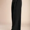 Pantaloni lunghi eleganti con bottoni, neri.