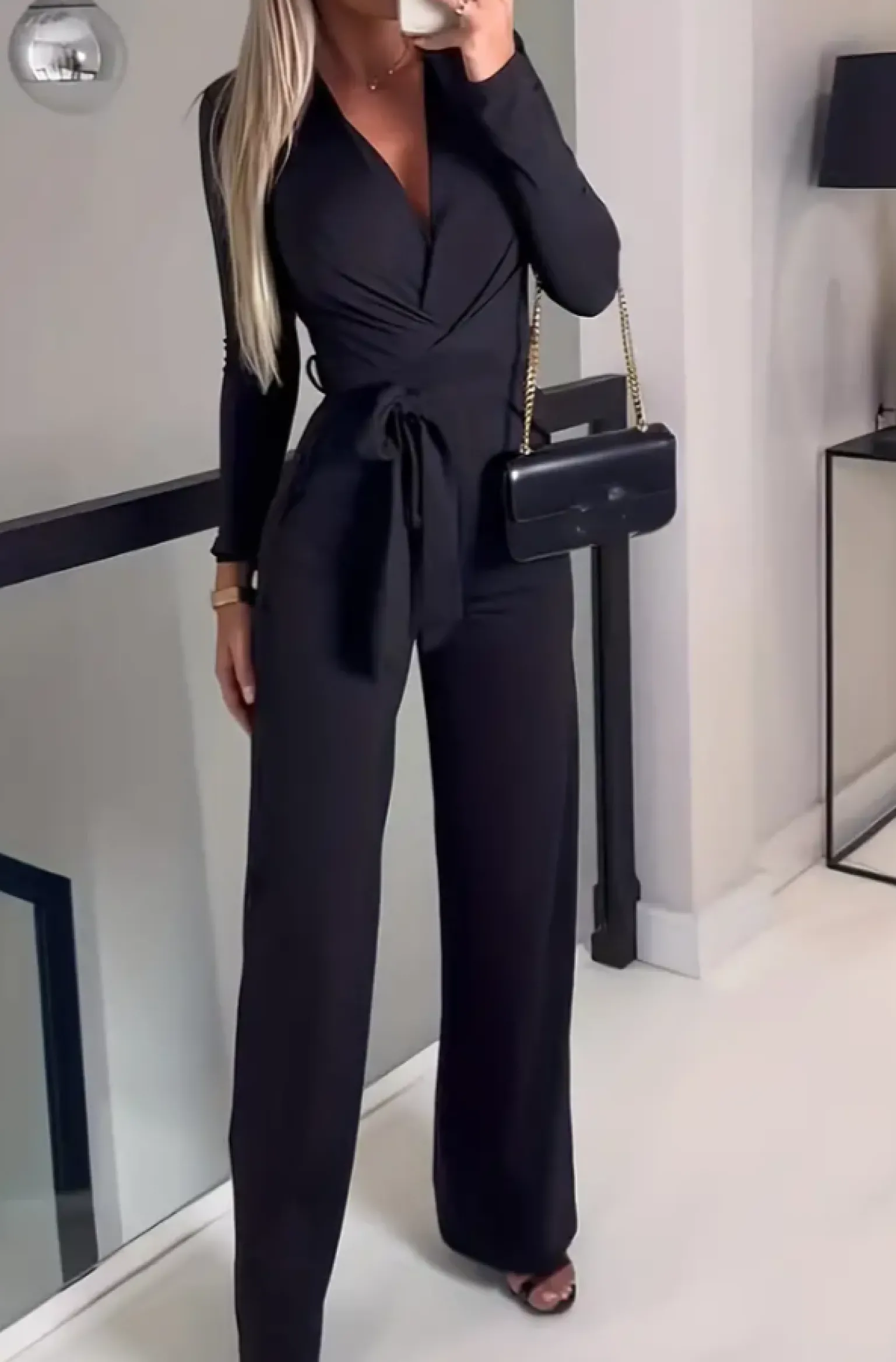 Tuta elegante a maniche lunghe, nera