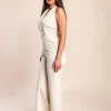 Tuta elegante con bottoni decorativi, beige