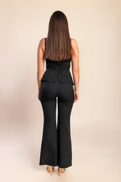 Tuta elegante con bottoni decorativi, nera